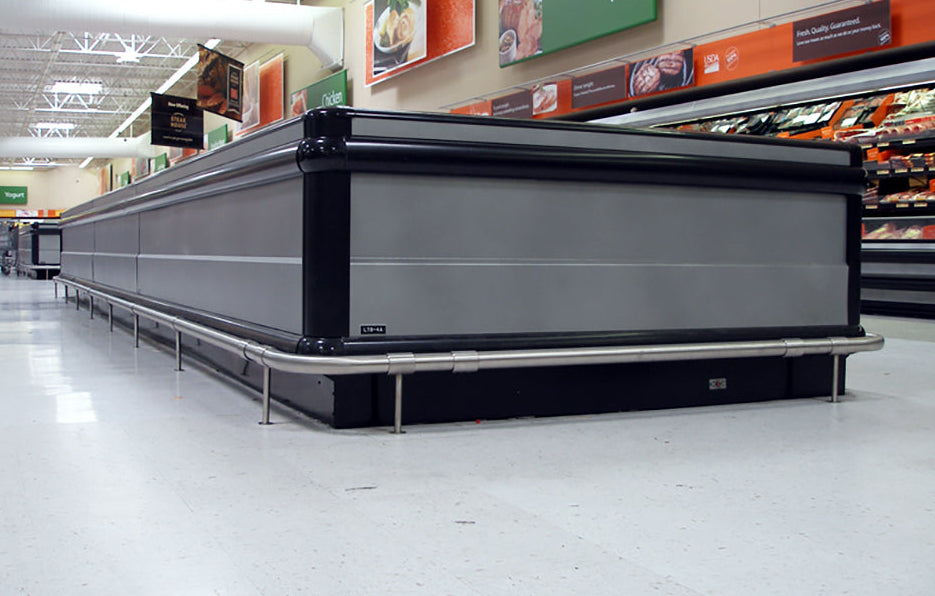 Long refrigerated display case in a grocery store aisle